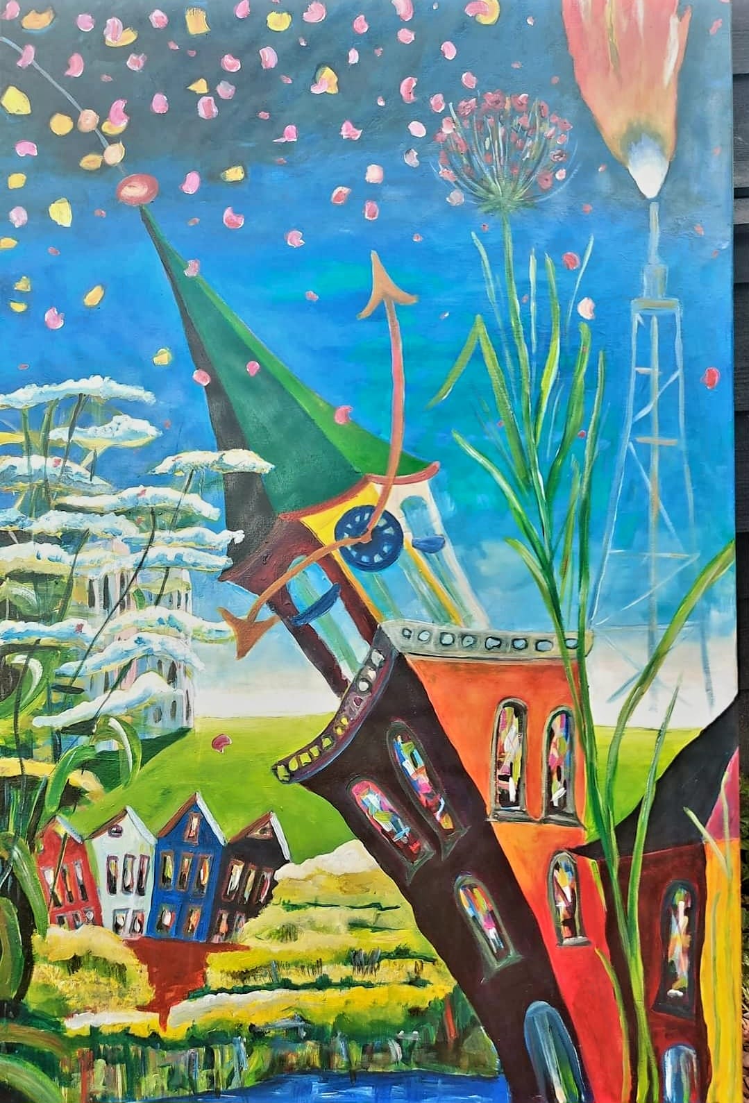 Artist studio with paintings and vintage photo cards